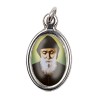 Médaille métal couleur argentée ovale H.2,5 cm avec résine, plusieurs saints.