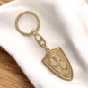 Porte-clés de Saint Michel en forme de bouclier- avec une croix au revers- Hauteur - 4-5 cm- Disponible en deux couleurs-