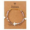 Bracelet sur corde réglable grains de forme cylindrique avec croix et coeur en coquille naturelle.