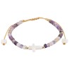 Bracelet sur corde réglable grains de forme cylindrique avec croix et coeur en coquille naturelle.
