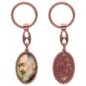 Porte-clés en aluminium de couleur cuivrée, hauteur 3,8 cm, avec résine. Disponible avec plusieurs saints au choix.