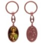 Porte-clés en aluminium de couleur cuivrée, hauteur 3,8 cm, avec résine. Disponible avec plusieurs saints au choix.
