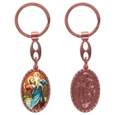 Porte-clés en aluminium de couleur cuivrée, hauteur 3,8 cm, avec résine. Disponible avec plusieurs saints au choix.