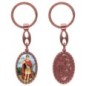 Porte-clés en aluminium de couleur cuivrée, hauteur 3,8 cm, avec résine. Disponible avec plusieurs saints au choix.