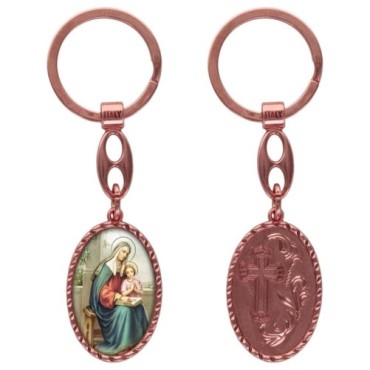 Porte-clés en aluminium de couleur cuivrée, hauteur 3,8 cm, avec résine. Disponible avec plusieurs saints au choix.