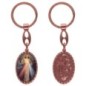 Porte-clés en aluminium de couleur cuivrée, hauteur 3,8 cm, avec résine. Disponible avec plusieurs saints au choix.